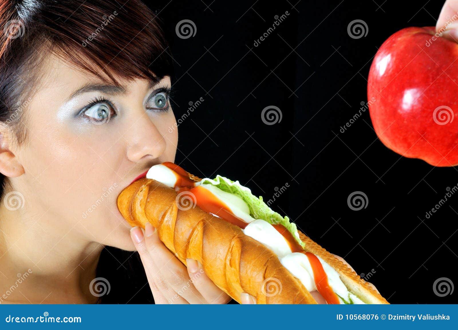 portrait-beautiful-hungry-girl-eating-sandwich-10568076.jpg